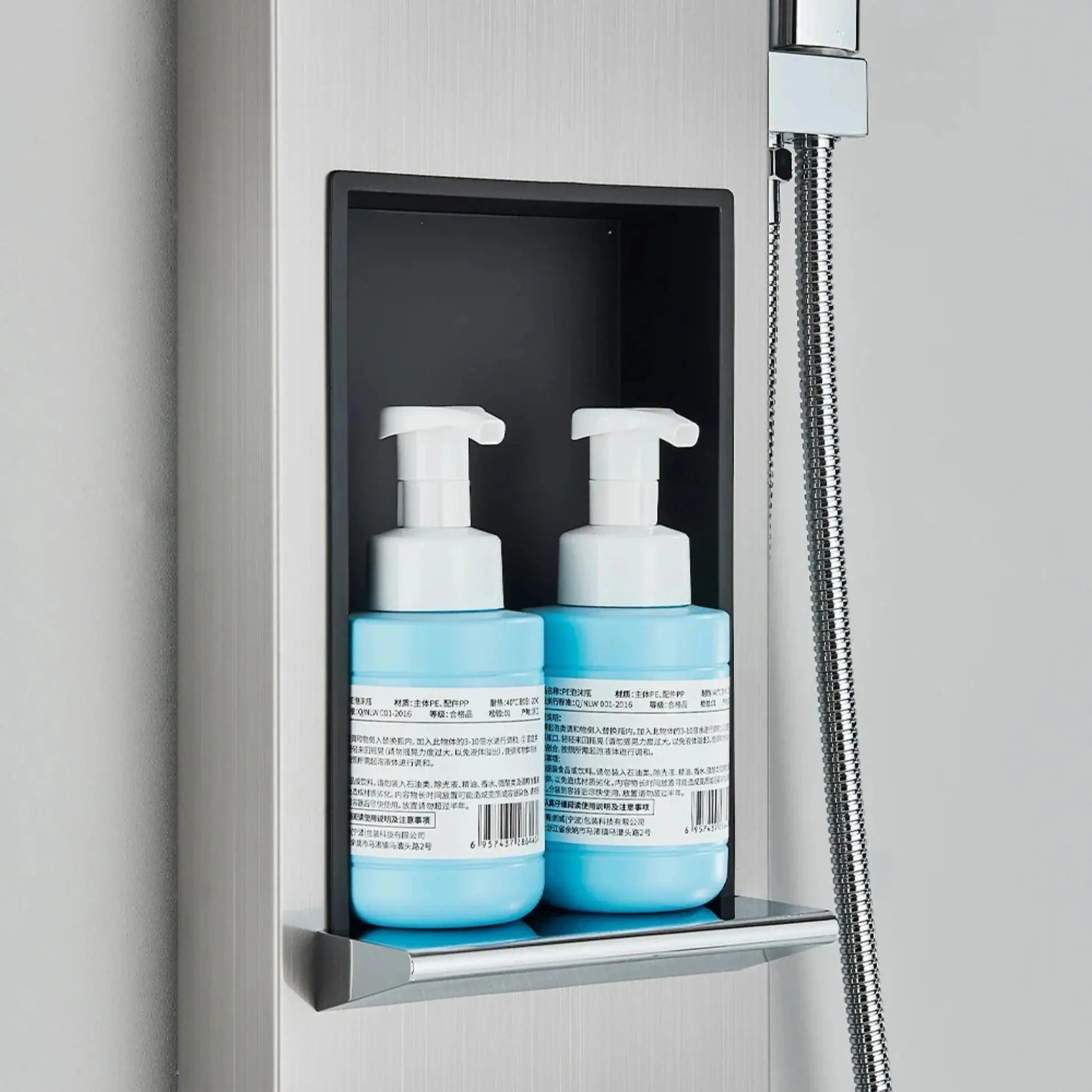 Brushed grey massage shower panel with body jets - mixer and controls close-up